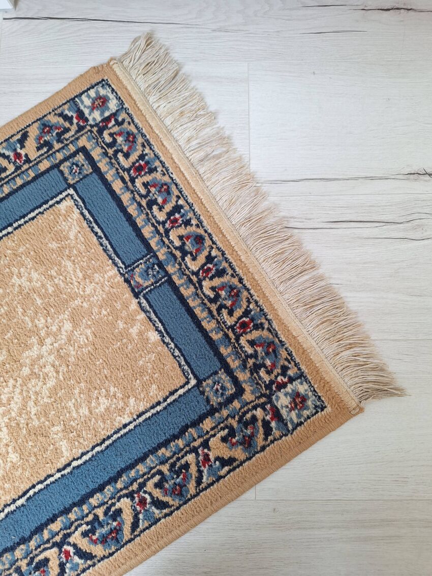 Beige and blue Persian rug