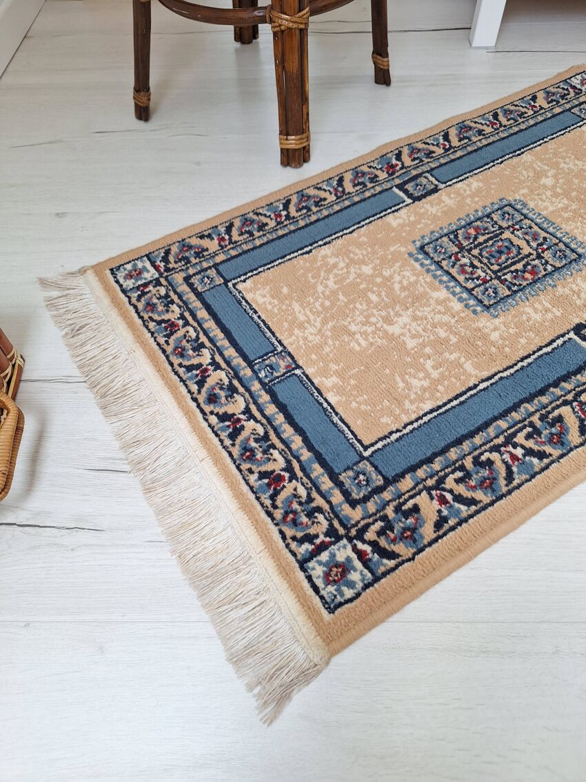 Beige and blue Persian rug