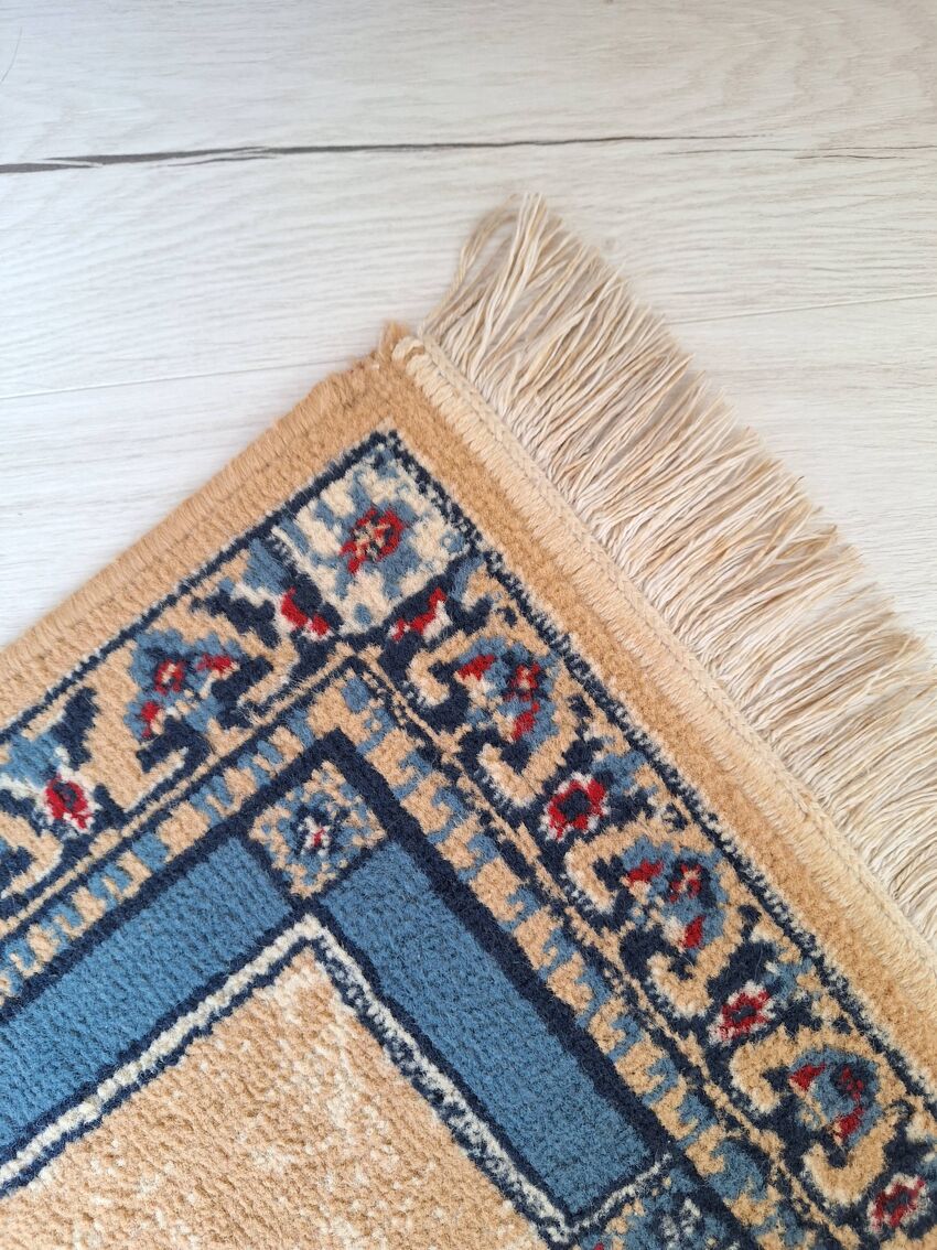 Beige and blue Persian rug